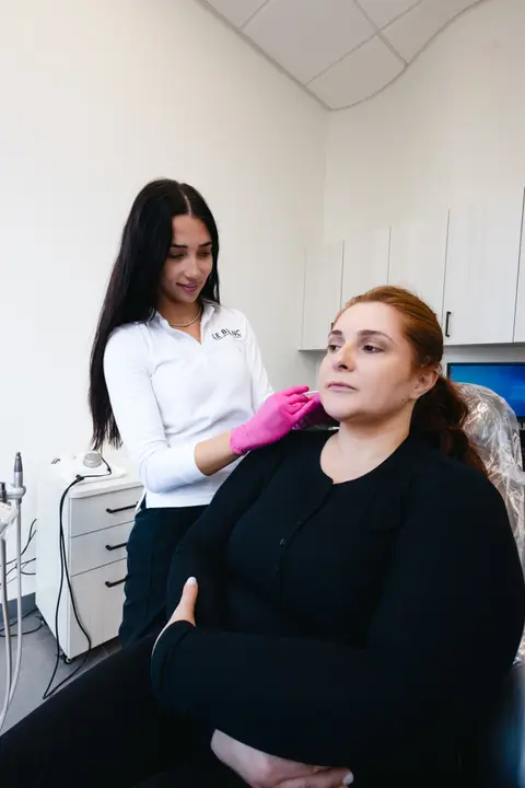 A LeBlanc clinician examining a patient before treatment