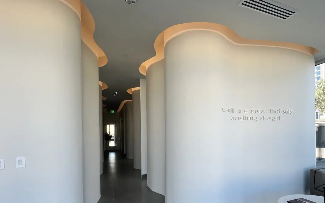 The LeBlanc hallway, with 'a smile is a curve that sets everything straight' on the wall